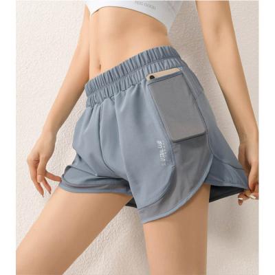 China Breathable Quick Dry High Waist Pocket Mesh Women's Yoga Shorts Yoga Shorts Anti Light To Wear Leisure Yoga Pants Loose Underpants for sale