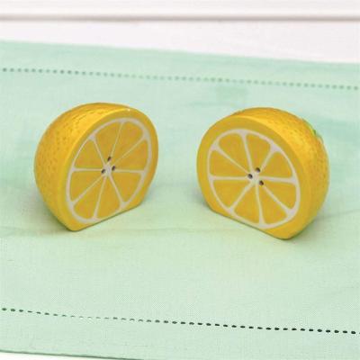 China Factory Price Unique Design Lemon Shape Kitchen Novelty Ceramic Salt and Pepper Set Kitchen Spice Salt Grinder for sale