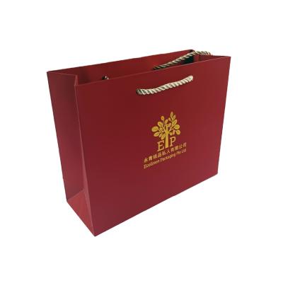 China Red Color Handmade Luxury Touch Paper Handbag 22*8*18cm With Gold Foil Printing for sale