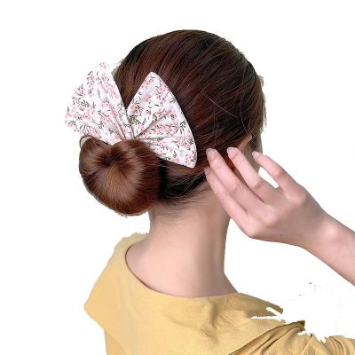 China Colorful Hair Bow Design Fashion Fabric Girl Women Girl Hair Disc Magic Twisting Hair Accessory for sale