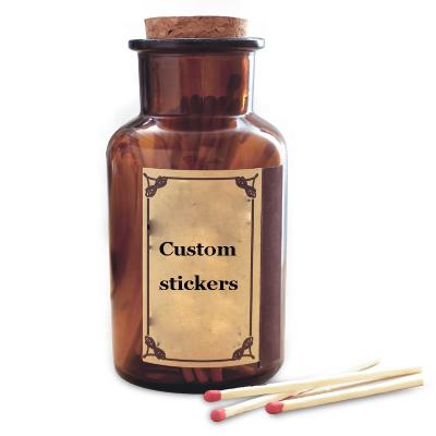 China Glass Packaging Custom Labels 1 Ounce 2 Ounce Amber And Clear Glass Matches Empty Jar With Cork for sale