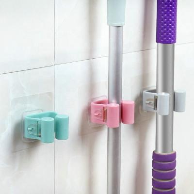 China Reusable Wall Mounted Home Bathroom Suction Rack Storage Holder Brush Broom Organizer Broom Hose Hangs Household Tools for sale