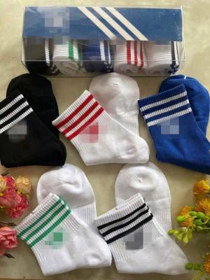 China Sporty Design Unisex Socks Letter Pattern Mens Womens Stripes Print Sport Cotton Socks for sale