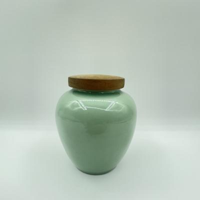 China Viable hot sale high quality round celadon piggy bank custom coin jar for sale