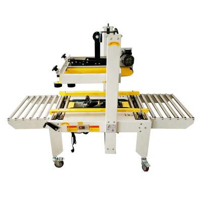 China FXJ-6050 Semi Automatic GARMENT Carton Sealer Machine With Manual Adjustable for sale