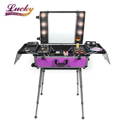 China Durable High Quality Aluminum Professional Trolley Case Multifunctional Beauty Studio Makeup Rolling Case With Light for sale