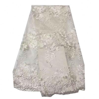 China Viable Top Selling White African Tulle Lace Fabric 3D Embroidery Applique Lace Fabric With Beads And Stones for sale