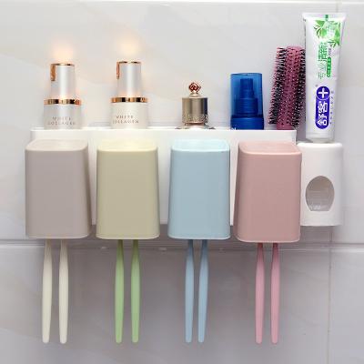 China Viable Multifunctional Wall Mounted Space Saving Organizer for 4 Person Family Toothbrush Holder with Toothpaste Dispenser for sale