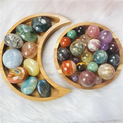 China DONGHAI Wholesale Natural Crystal Spheres Palmstone Display Wooden Plates Moon Shape for Home Decoration for sale