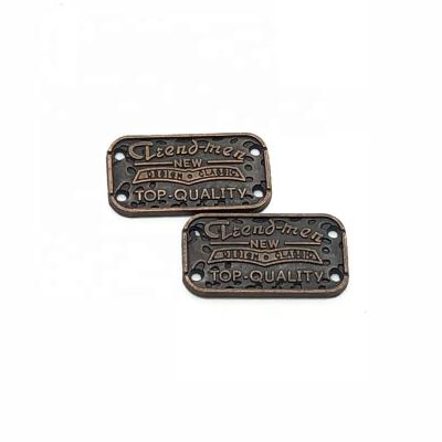 China Viable Order Accept Brand Metal Label 2 Holes Copper Metal Tag for sale