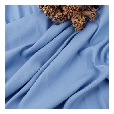 China 100 high quality polyester QUICK DRY 90g silk like plain weave and summer dress polyester island spring silk pendent woven fabric for sale