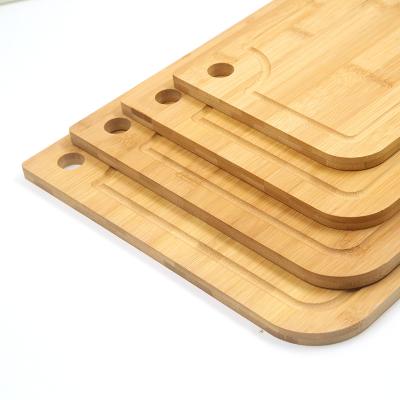 China Sustainable 100% Natural Bamboo Cutting Board 4 Piece Set Juice Bowl, Handle Tray, Kitchen for Cutting Cheese and Vegetables for sale