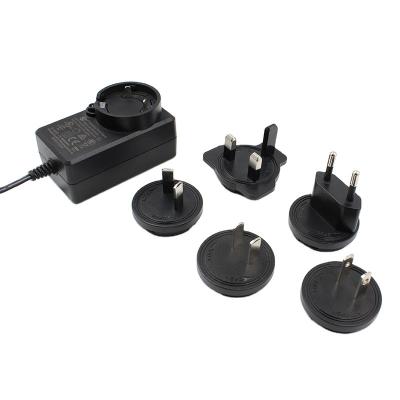 China UniversalÂ   CE Cb Us Standard FCC Plug Adapter 5v 1a 2a 3a Interchangeable Adapter For Eu Us Au British Worldwide Certified for sale