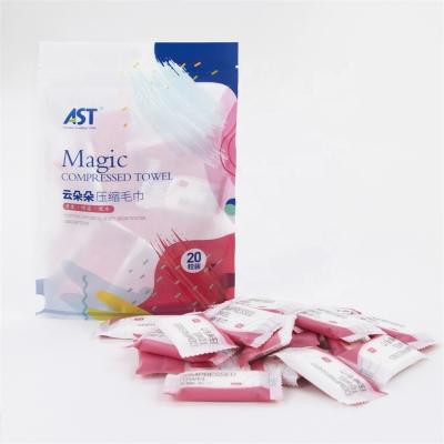 China Compressed Disposable Biodegradable Magic Coin Compressed Napkin With Candy Packet en venta