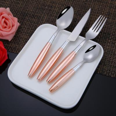 China Home and Hotel 16pcs Hot Selling Viable Stainless Steel Gold Color Flatware Colorful Round Plastic Handle Flatware Set for sale