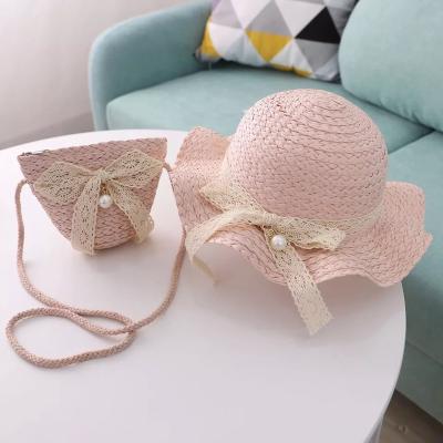 China New Wholesale Comfortable Wide Brim Summer Kids Beach Sun Hat Kids Girl Bucket Straw Hat Flower Bag Two Outdoor Travel Beach Hats for sale