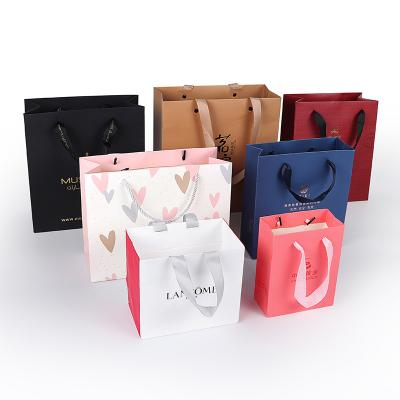 Κίνα Biodegradable Custom Luxury Garment Bag Packing Pink Bolsas De Papel Shopping Bag Gift Packaging Paper Bags With Handles For Clothes προς πώληση