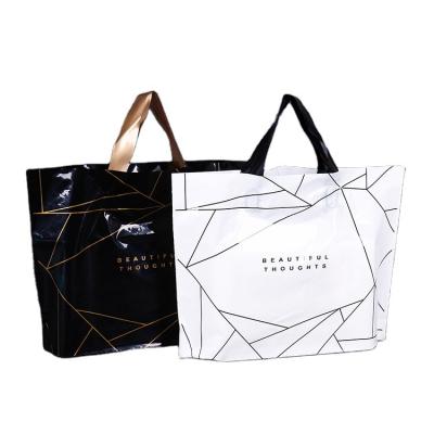 China PE webshop clothing package moisture proof custom black plastic carry bags custom logo printing shopping plastic bags with handles for sale