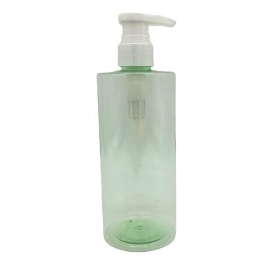 China 525ml PET Plastic Cosmetic Packaging Round Bottle Shampoo And Shower Gel Bottle With Pump for sale