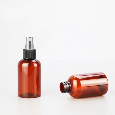 China Household Products 4oz 120ml Amber Capsule PET Boston Round Custom Bottle Portable Plastic Spray Bottle With Lid for sale