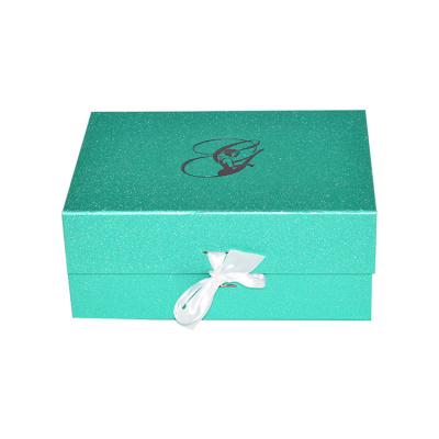 China Recyclable Custom Logo Luxury Cardboard Magnetic Fold Flat Gift Boxes With Ribbon Closure for sale