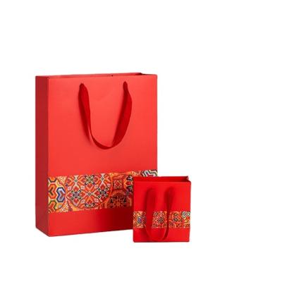 China Exquisite New Design Customized Logo Red Chinese Wind Reusable Gift Packaging Bags for sale