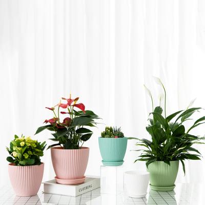 China 2021 Modern Flower Wedding Designer Plant Pot Outdoor Plastic Garden Planter Pot With Tray for sale