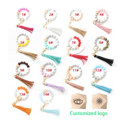 China Cute In Running Hot Selling Colorful Leather Key Ring Women Girls Wood Silicone Amazon PU Monogram Tassel Beads Key Chain Bracelet for sale