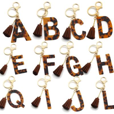 China Hot Selling A-Z 26 Fashion Leopard Design Amazon Letters Ring Pu Leather Tassel Girl Acrylic Key Bracelets Leather Key Chain for sale