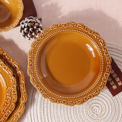 China Sustainable Western Decoration Embossed Plates Vintage Brown Ceramic Glaze Soup Dish With Relief for sale