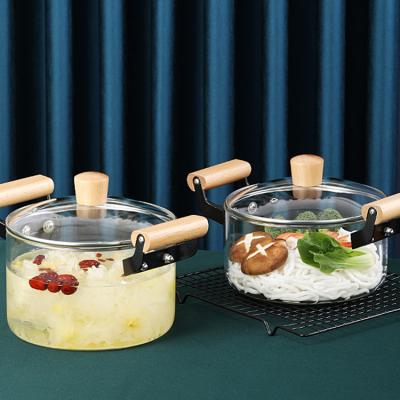 China New Design Sustainable Borosilicate Clear Glass Cooking Jar Cookware With Wooden Handles for sale