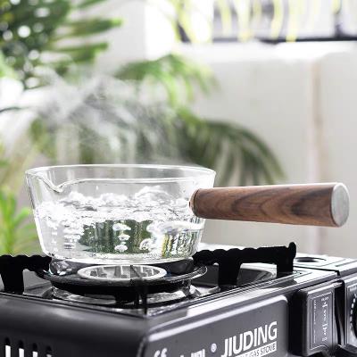 China Sustainable Borosilicate Glass Milk Pot Cooking Soup Pan Small Saucepan With Wooden Handle Home Cookware Glass Jar for sale