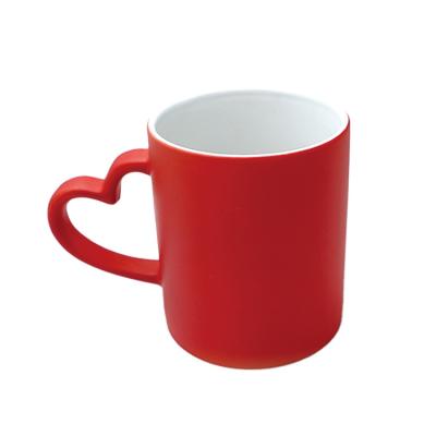 China Viable Black Red Blue Ceramic Magical Color Changing Cup Mug With Heart Handle for sale