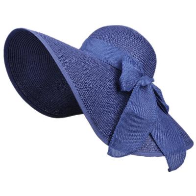 China Image Of Big Bowknot Roll Up Beach Hats Foldable Soft Straw Sun Hat for sale