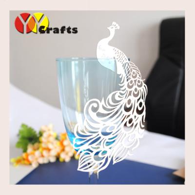 China Popular laser cut wedding place card white peacock on wine glass decorations for sale