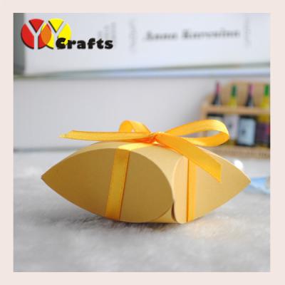 China Laser Cut Pillow Favor Boxes Gold Gift Pack Box With Gold Ribbon for sale