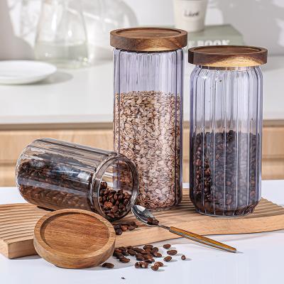 China Wholesale Cheap Freshness Preservation Food Grade Customized Logo Glass Canister With Wooden Lid for sale