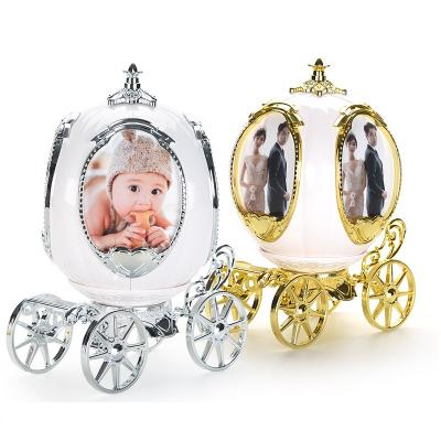 China Custom Pumpkin Carriage 360 ​​Sides Rotating 4 Plastic Photo Frame Music Box For Home Decor for sale