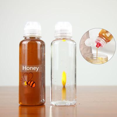 China Wholesale Portable Household Plastic Honey Bottle Flip Top Cap Round Storage Products for sale