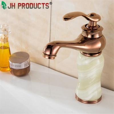 China Artistic Sense Faucets and Antique Brass Basin Faucet for sale