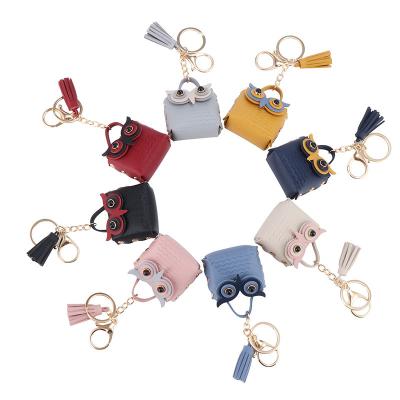 China Owl Cartoon Leather Keychain Headset Hanging Key Chain Coin Bag Storage Lightweight Multicolor Small Purse Bag for sale