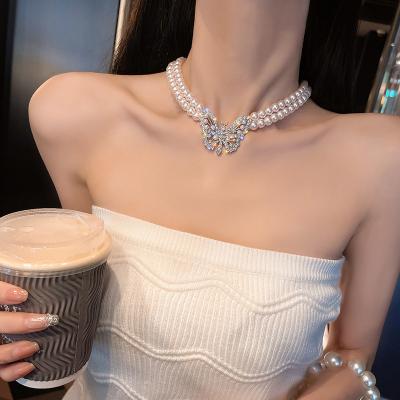 China New Fashionable Multilayer Temperament Elegant Diamond Butterfly Pearl Pendant Necklace Clavicle Chain For Women for sale