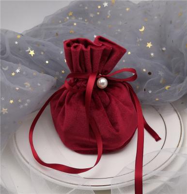 China Creative Drawsting Pocket Christmas Gift Bag With Bell And Card Small Wedding Velvet Drawstring Bag for sale