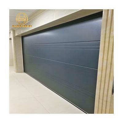 China Heat Insulation Suede Grain Color Steel Sectional Automatic Garage Door for sale