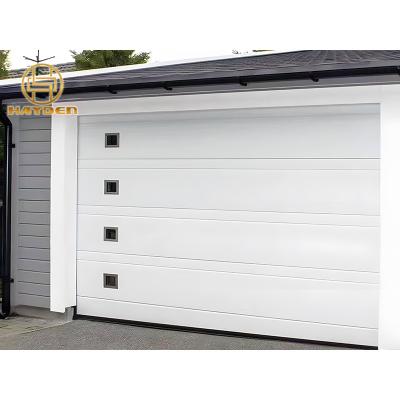 China Heat Insulation Soft Style Sectional Automatic Garage Door With Perspective Windows for sale