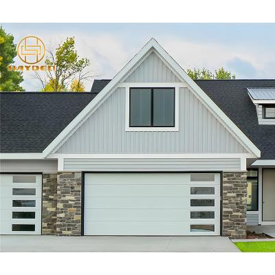 China Heat Insulation Embossed Sectional Automatic Garage Door With Perspective Windows for sale