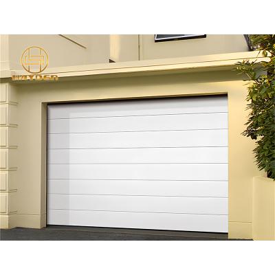 China Heat Insulation Embossed Color Steel Sectional Automatic Garage Door for sale