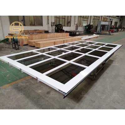 China Windproof White Aluminum Frame Coated Glass Garage Door for sale