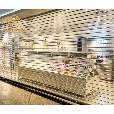 China Anti Theft Commercial Transparent Electric Polycarbonate Roller Shutter Door for sale