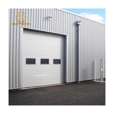 China Thermal Insulation Electric Lift Overhead Sectional Industrial Door for sale